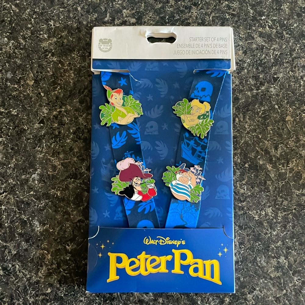 ✨Walt Disneys Peter Pan Starter Pin Set✨ Never worn, org pkg. Comes w/ Lanyard.